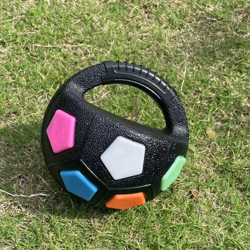 Black handle with colorful hexagonal grips on grass