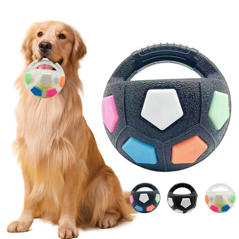Dog playing with a colorful ball and holding a textured toy, with additional toys displayed below.